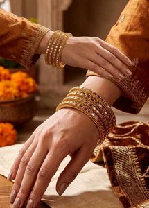 Elegant Gold Bangles with Embellishments