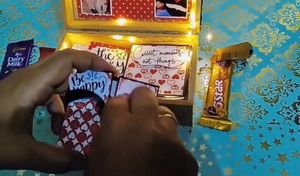 gift box with 10 cards inside and chocolte