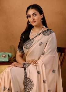 Elegant Peach Saree with Black Embroidery