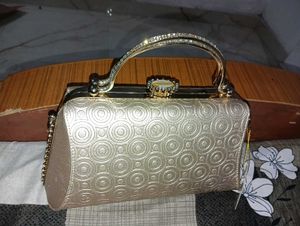Elegant Gold Embossed Clutch Bag