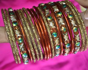 Orange And Golden Colour Bangles