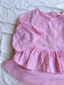 Chic Pink Peplum Top with Pearl Embellishments