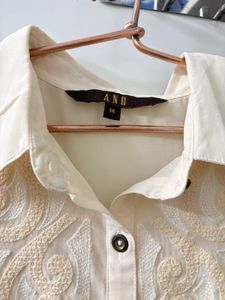 Elegant Cream Embroidered Sleeveless Blouse