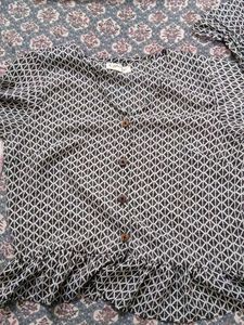 Black symmetrical designed top with full sleeves