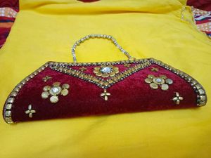 Dark maroon Fancy Clutch...