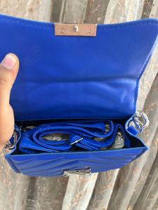 Blue sling purse