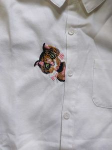 Chic White Button-Up Shirt with Embroidered Detail
