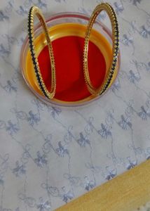 Elegant Gold Bangles with Blue Stones