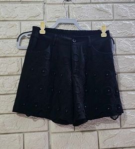 Chic Black Eyelet Shorts with Embellishments