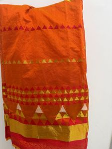 Vibrant Orange Saree with Golden Accents