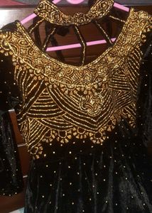Elegant Black Velvet Gown with Gold Embellishments