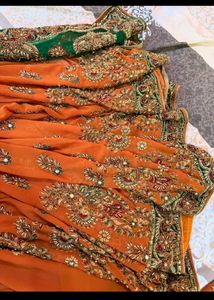 Exquisite Orange Embroidered Saree