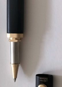 Elegant Black and Gold Pen with Velvet Sleeve