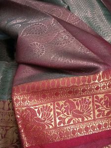 Elegant Teal Saree with Red Border