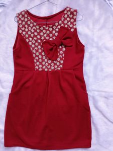Free Delivery red dress with lace and bow detail.