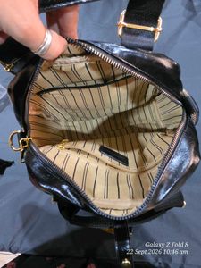 Chic Black Patent Clutch Bag with gold detailing.