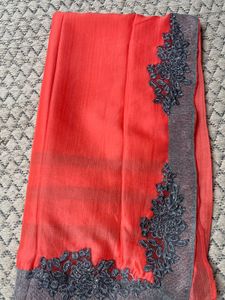 Vibrant Coral Saree with Embellished Border