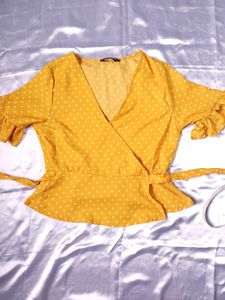polka dot yellow wrap top.
