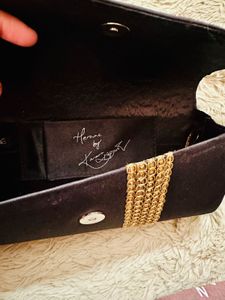 Elegant Black Clutch with Gold Embellishments