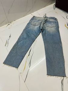 Distressed Blue Denim Jeans