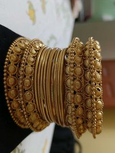 Peacock jhumka with golden bangles
