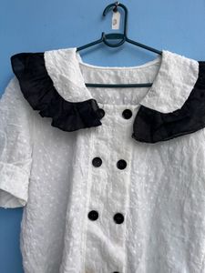 Chic White Top with Black Collar