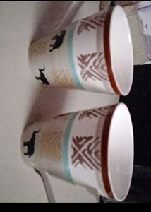 A PAIR OF ELEPHANT DESIGNED MUGS NEW