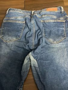 Distressed Blue Denim Jeans
