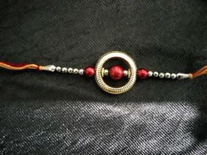 Elegant Rakhi with Red Pearls