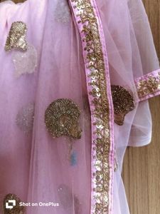 Pink net saree with sequin zari motifs