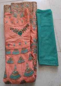 Ethnic peach gown with rich embroidery