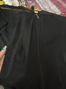 transparent black shrug top with zip