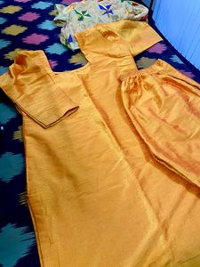 Musturd colour suit with fulkari dupatta