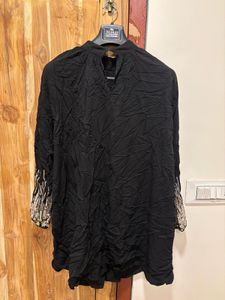 Chic Black Dress with Embellished Sleeves