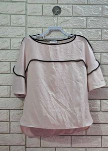 Calvin Klein Women's soft pink hue or light cream.