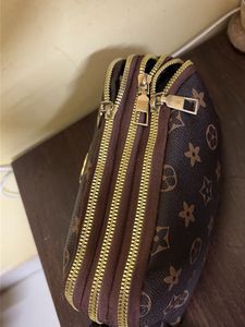 Spacious 3 compartment sling bag
