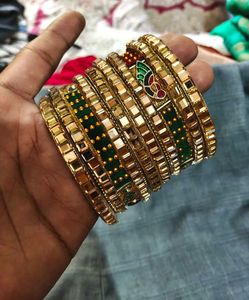 Set of Golden Bangles with Green Embellishments