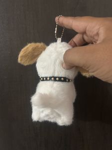 fluffy white puppy plush keychain featuring