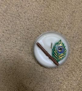 Decorative Candle with Flute &amp; Peacock Feather