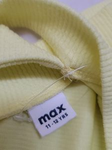 A yellow crop off-shoulder top