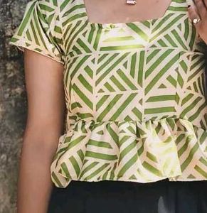 This is a light green crop top.