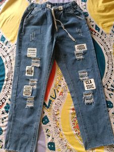 Distressed Blue Denim Jeans