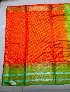 Vibrant Orange Silk Saree with Green Border