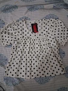 white polka dot top