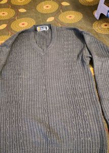 Gray V-Neck Knit Sweater and curtain