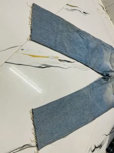 Distressed Blue Denim Jeans