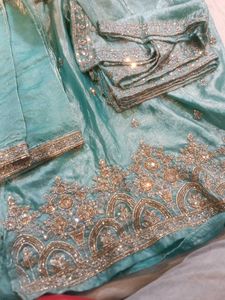 Exquisite Teal Kurta Set with Intricate Embellishm