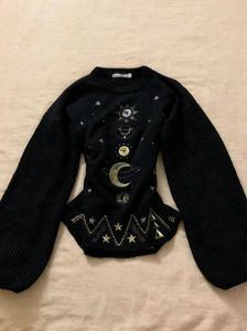 Space embroidered sweater
