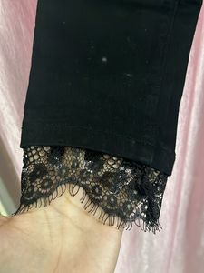 Stylish Black Lace Hem Jeans
