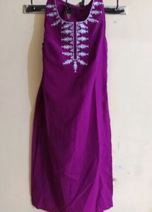 Dark Purple Shiny A Line Kurti Of Size-xs/'s' available...Length Is Just Below The Knee.....Apair Of Sleeves With An Extra Button Available Inside It